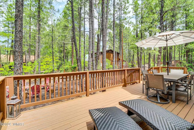 6436 Mark Twain Dr, Pinetop, AZ 85935 - wooden terrace featuring outdoor dining space and view of scattered trees