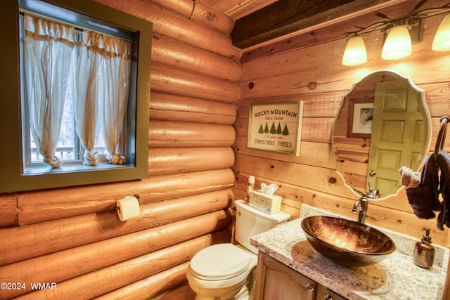 6436 Mark Twain Dr, Pinetop, AZ 85935 - half bathroom featuring toilet, vanity, and log walls