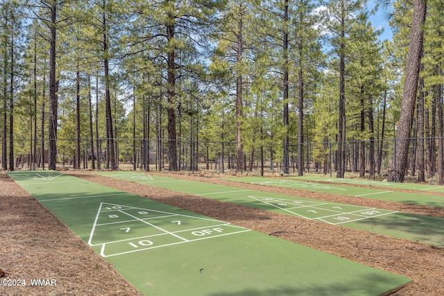 6436 Mark Twain Dr, Pinetop, AZ 85935 - view of home's community featuring shuffleboard, fence, and a forest view
