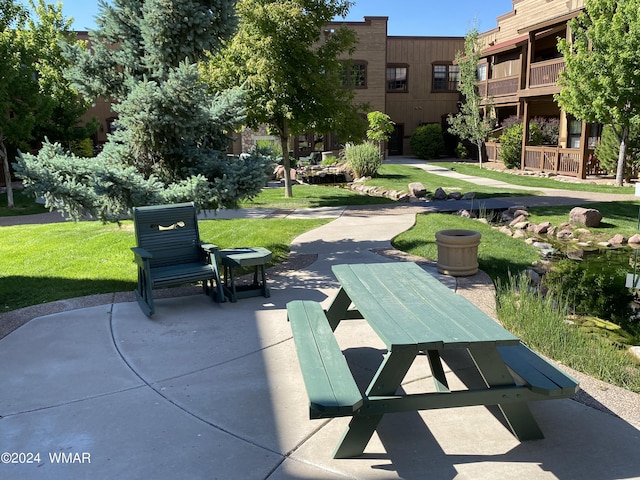 view of home's community with a lawn