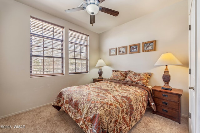 bedroom featuring carpet floors, baseboards, and ceiling fan