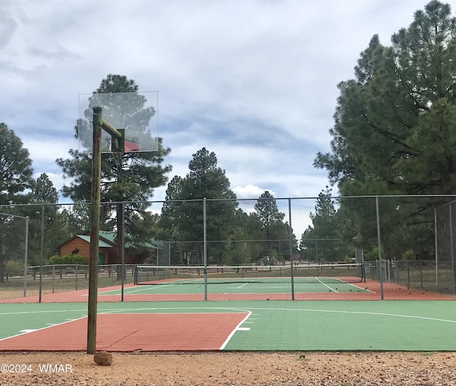 view of sport court with community basketball court and fence