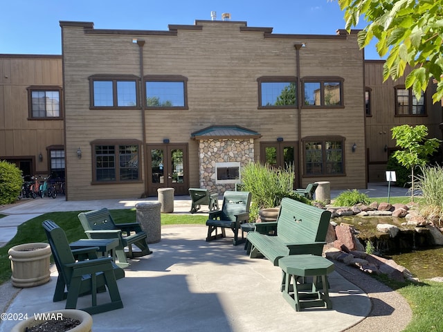 view of property's community with a patio