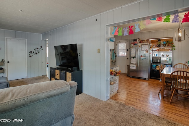 720 S 26th Ave, Show Low, AZ 85901 - living room featuring carpet floors, wood finished floors, and wood walls