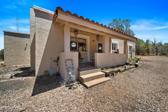 1051 Dusty Ln, Show Low, AZ 85901 - property entrance featuring stucco siding and a tile roof