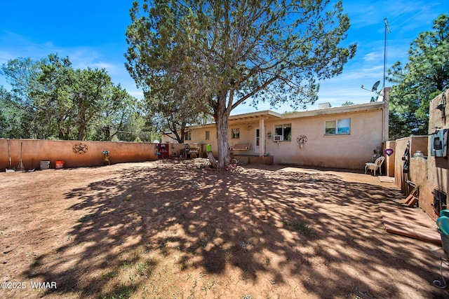 1051 Dusty Ln, Show Low, AZ 85901 - back of house with stucco siding and a patio area