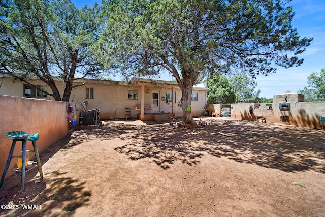 1051 Dusty Ln, Show Low, AZ 85901 - back of house with stucco siding and a patio