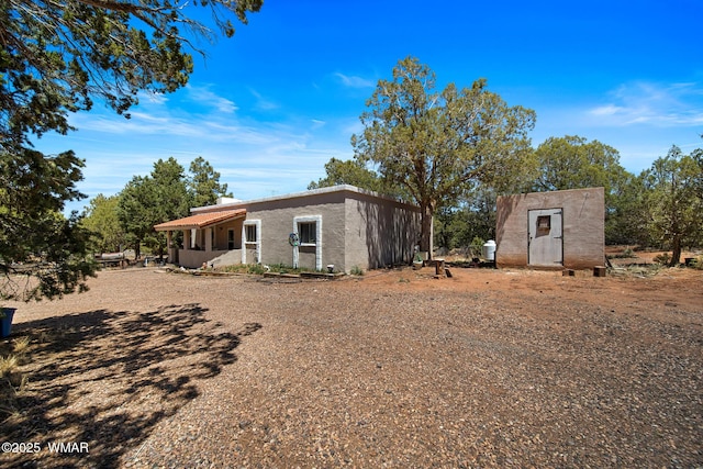 1051 Dusty Ln, Show Low, AZ 85901 - rear view of house featuring stucco siding