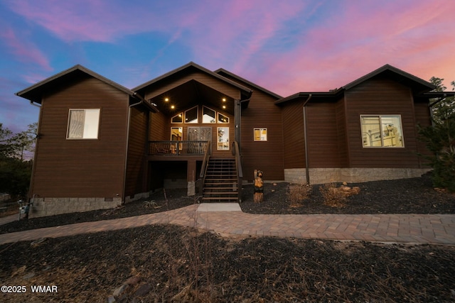 rustic home featuring stairs and crawl space