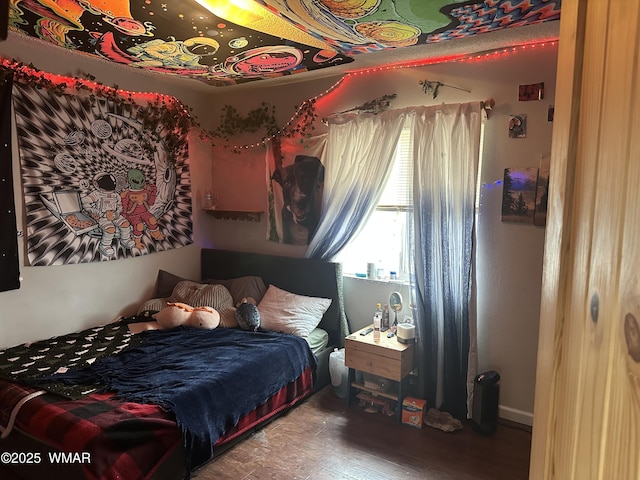 bedroom featuring wood finished floors