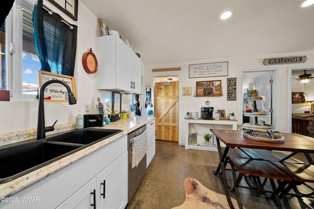 3036 W Plum Blossom Ln, Snowflake, AZ 85937 - kitchen with stainless steel dishwasher, finished concrete flooring, white cabinets, and recessed lighting