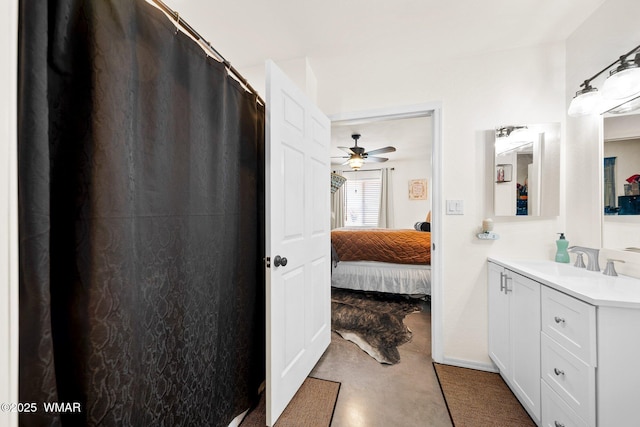 3036 W Plum Blossom Ln, Snowflake, AZ 85937 - ensuite bathroom featuring vanity, a ceiling fan, a shower with curtain, and concrete flooring