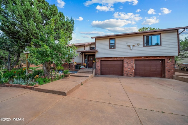 6711 Bandido Way, Show Low, AZ 85901 - view of front facade with brick siding, an attached garage, and driveway