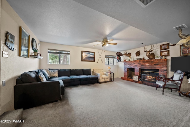 6711 Bandido Way, Show Low, AZ 85901 - carpeted living area featuring a brick fireplace, plenty of natural light, a ceiling fan, and a textured ceiling