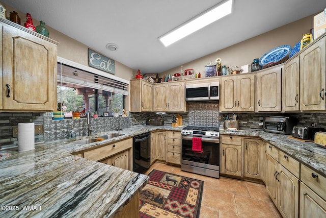 6711 Bandido Way, Show Low, AZ 85901 - kitchen with appliances with stainless steel finishes, decorative backsplash, light stone countertops, lofted ceiling, and light brown cabinets