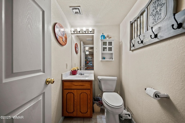 6711 Bandido Way, Show Low, AZ 85901 - bathroom featuring a textured ceiling, vanity, and tile patterned flooring