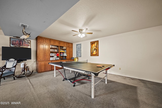 6711 Bandido Way, Show Low, AZ 85901 - playroom featuring a ceiling fan, light carpet, and a textured ceiling