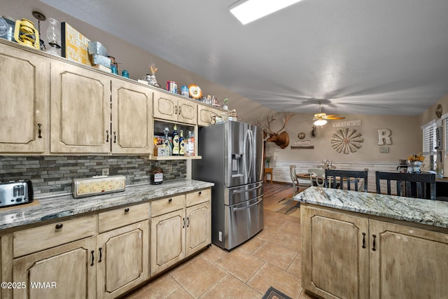 6711 Bandido Way, Show Low, AZ 85901 - kitchen with stainless steel fridge with ice dispenser, ceiling fan, light brown cabinets, backsplash, and wainscoting