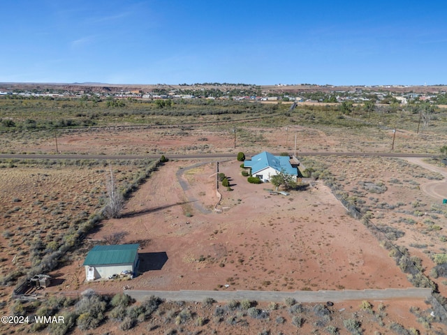 birds eye view of property featuring a rural view