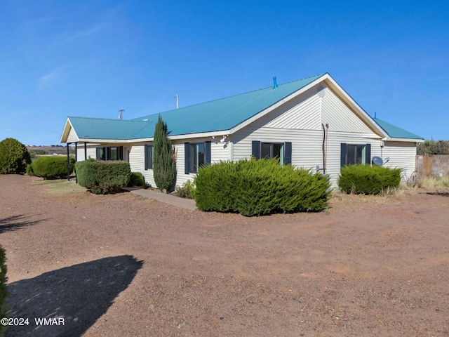 view of front of home featuring metal roof