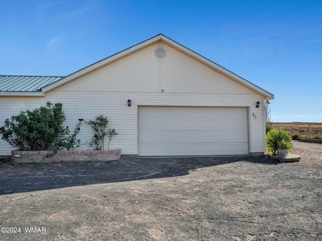 garage featuring driveway