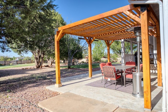 view of patio / terrace featuring a pergola and outdoor dining space