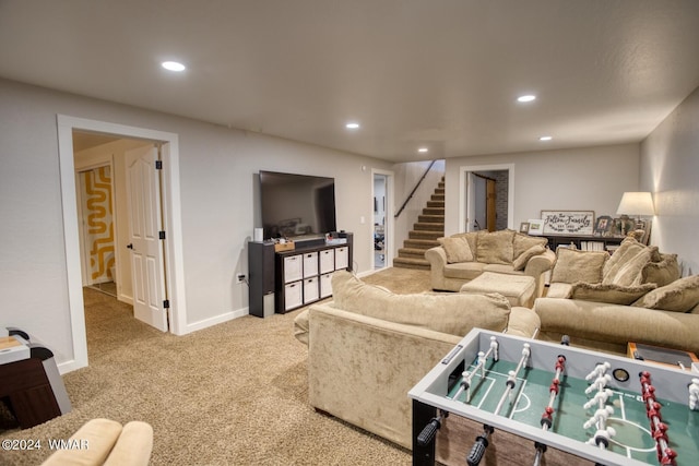 living area with light carpet, stairway, and recessed lighting