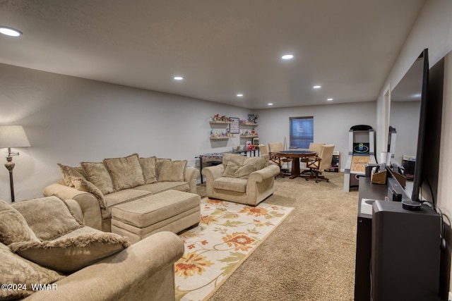 living area with recessed lighting and light colored carpet