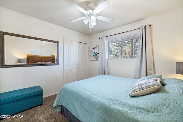 carpeted bedroom with a closet and ceiling fan