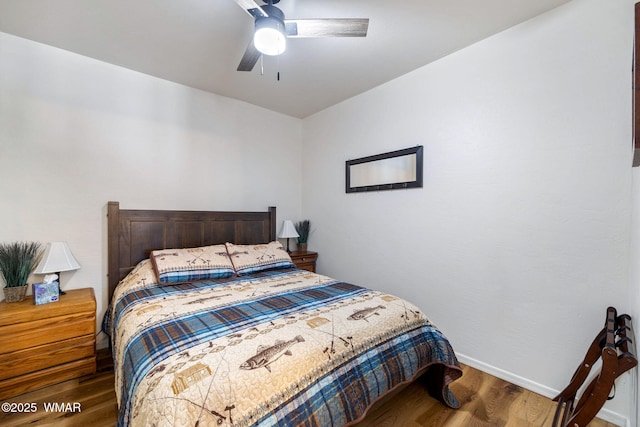 bedroom with dark wood-style floors, baseboards, and a ceiling fan