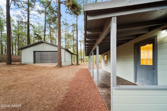 1259 S Penrod Dr, Pinetop, AZ 85935 - view of side of property with an outdoor structure and a detached garage