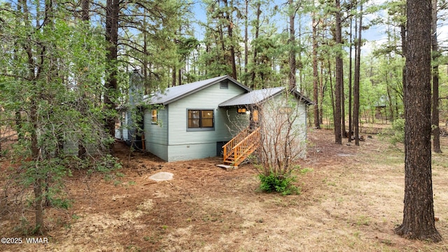 1259 S Penrod Dr, Pinetop, AZ 85935 - view of front facade with stairway and a metal roof