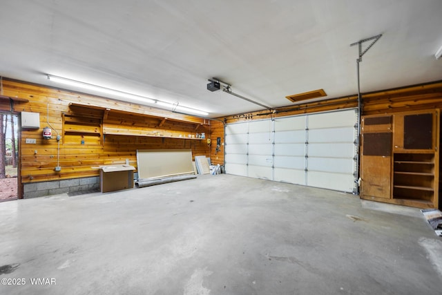 1259 S Penrod Dr, Pinetop, AZ 85935 - garage with wooden walls and a garage door opener