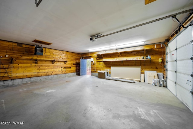 1259 S Penrod Dr, Pinetop, AZ 85935 - garage with a garage door opener and wooden walls