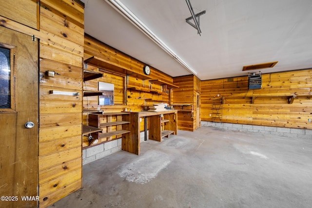 1259 S Penrod Dr, Pinetop, AZ 85935 - basement with a workshop area, wood walls, and a garage