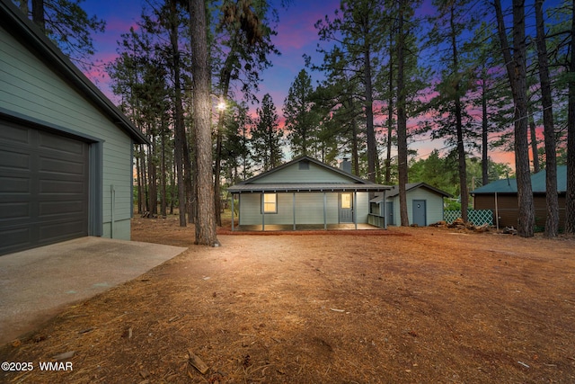 1259 S Penrod Dr, Pinetop, AZ 85935 - view of front of home with an outbuilding, a garage, and driveway