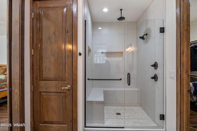 bathroom featuring a shower stall and recessed lighting