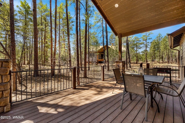 wooden deck featuring outdoor dining space