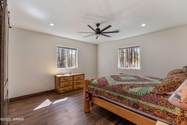 bedroom featuring multiple windows, dark wood finished floors, recessed lighting, baseboards, and a ceiling fan