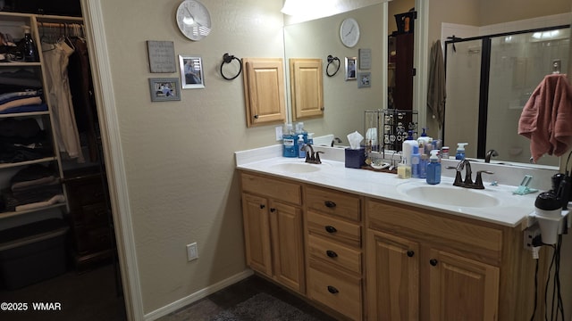 1050 E Jefferson St, Snowflake, AZ 85937 - full bath featuring double vanity, a spacious closet, a stall shower, and tile patterned floors