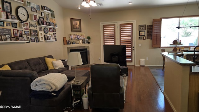 1050 E Jefferson St, Snowflake, AZ 85937 - living room with dark wood finished floors, a ceiling fan, and a fireplace