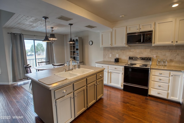 kitchen with visible vents, range with electric cooktop, black microwave, and a sink