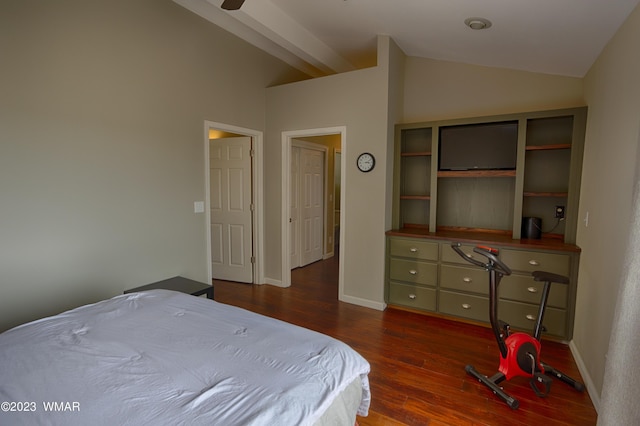 bedroom featuring dark wood finished floors, baseboards, and lofted ceiling