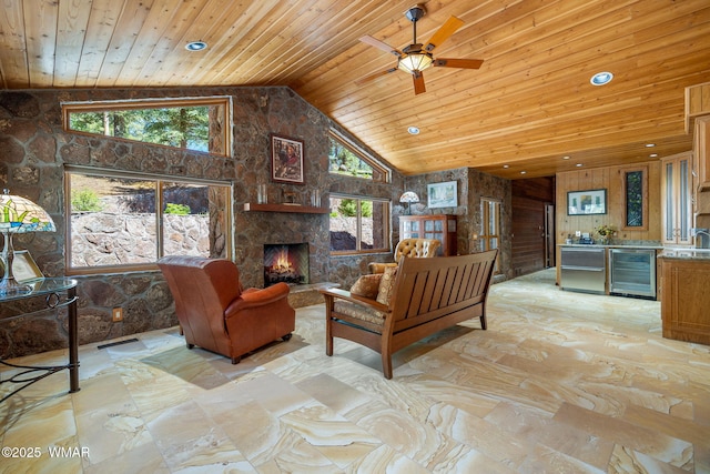 38684 State Route 373, Greer, AZ 85927 - living area with beverage cooler, wooden ceiling, high vaulted ceiling, a fireplace, and healthy amount of natural light