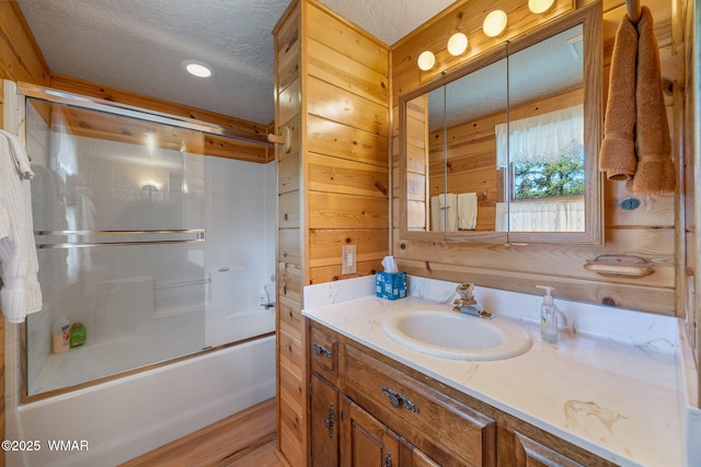38684 State Route 373, Greer, AZ 85927 - bathroom featuring vanity, a textured ceiling, and shower / bath combination with glass door