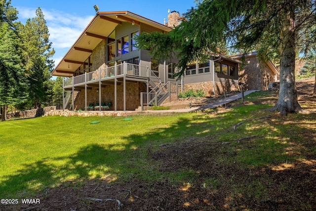 38684 State Route 373, Greer, AZ 85927 - back of house featuring stairway, stone siding, a wooden deck, a yard, and a chimney