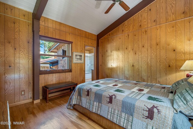 38684 State Route 373, Greer, AZ 85927 - bedroom with wooden walls, wood finished floors, and vaulted ceiling