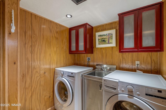 38684 State Route 373, Greer, AZ 85927 - laundry area featuring cabinet space, washer and dryer, and wood walls