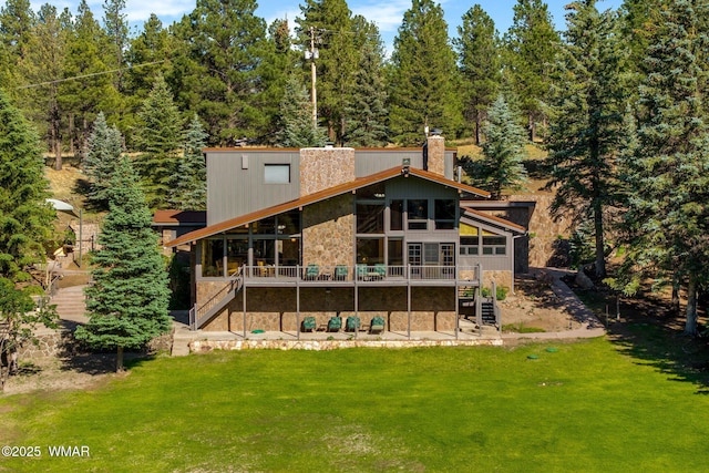 38684 State Route 373, Greer, AZ 85927 - rear view of house featuring stairway, stone siding, a yard, a wooden deck, and a chimney