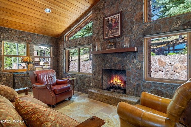 38684 State Route 373, Greer, AZ 85927 - living area with wooden ceiling, plenty of natural light, a stone fireplace, and high vaulted ceiling